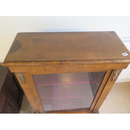 561 - A mid 19th century pier cabinet fitted with a single glazed door enclosing two shelves - 102cm x 76c... 