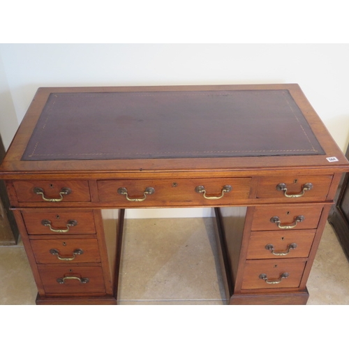 564 - A Victorian walnut nine drawer pedestal desk with inset leather scriber - 106cm x 58cm x 77cm