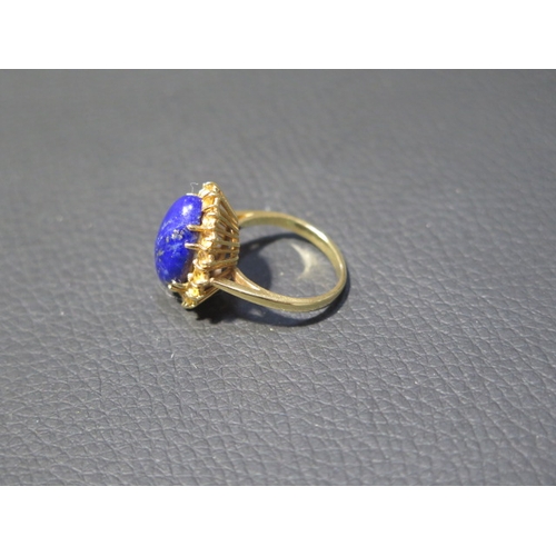 78 - An 18ct yellow gold Lapis Lazuli and citrine ring - the central oval Lapis approx 1.5cm surrounded b... 