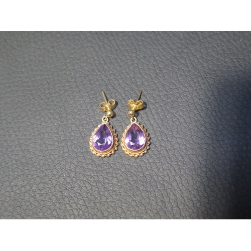 84 - A pair of 9ct yellow gold and amethyst drop earrings - approx 1.8cm - weight approx 2.7 grams