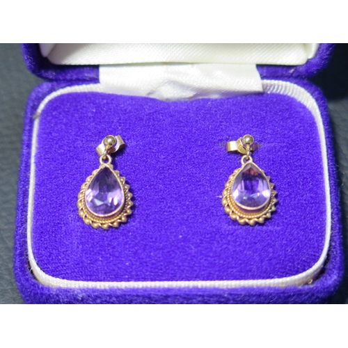 84 - A pair of 9ct yellow gold and amethyst drop earrings - approx 1.8cm - weight approx 2.7 grams