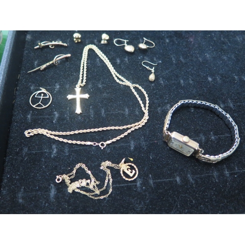 95 - A quantity of 9ct gold jewellery and a chain and cross - approx total weight 9 grams - and an Avia l... 