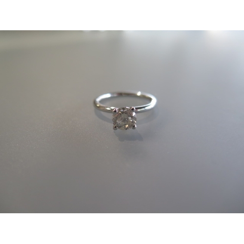 176 - A diamond solitaire ring size M/N - diamond weight 1.02ct - stamped 14ct with AIG certificate - appr... 