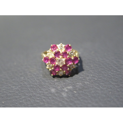 209 - An 18ct yellow gold diamond and ruby cluster ring size J/K - weight approx 5.1 grams