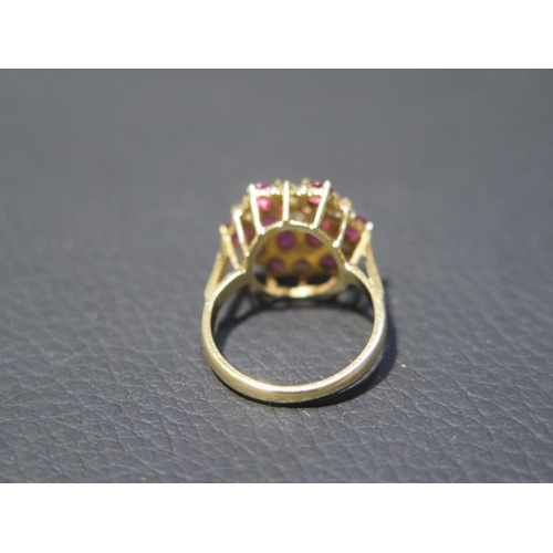 209 - An 18ct yellow gold diamond and ruby cluster ring size J/K - weight approx 5.1 grams