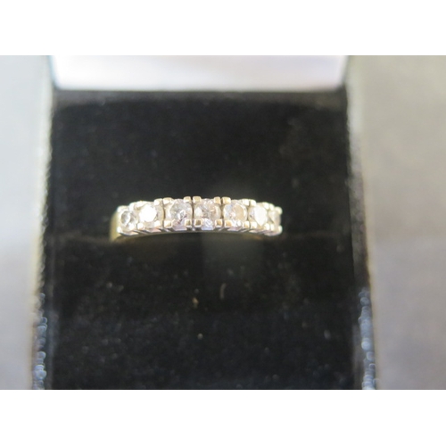 212 - An 18ct yellow gold and diamond half eternity ring size P - weight approx 3.9 grams