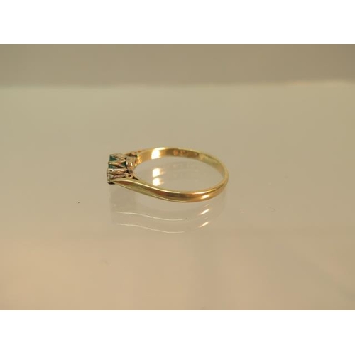 100 - A 9ct yellow gold (hallmarked) emerald and diamond three stone ring size N - weight approx 1.9 grams