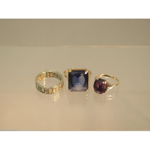 101 - Three 9ct gold rings (hallmarked) blue glass ring size S, amethyst ring size L and eternity ring siz... 