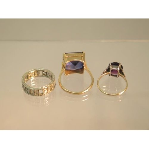 101 - Three 9ct gold rings (hallmarked) blue glass ring size S, amethyst ring size L and eternity ring siz... 