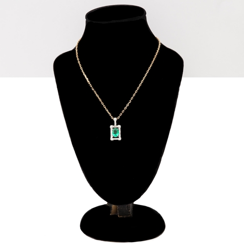 102 - A certificated stylish 18ct white gold oval-cut emerald and diamond pendant on an 18ct rose gold cha... 