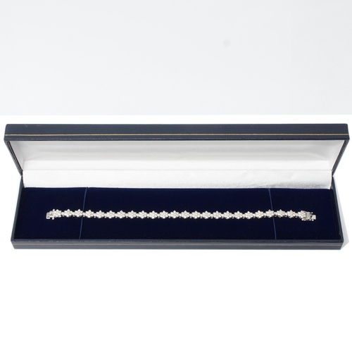 106 - An 18ct white gold daisy-style diamond cluster bracelet, with double safety clasp and box - round br... 