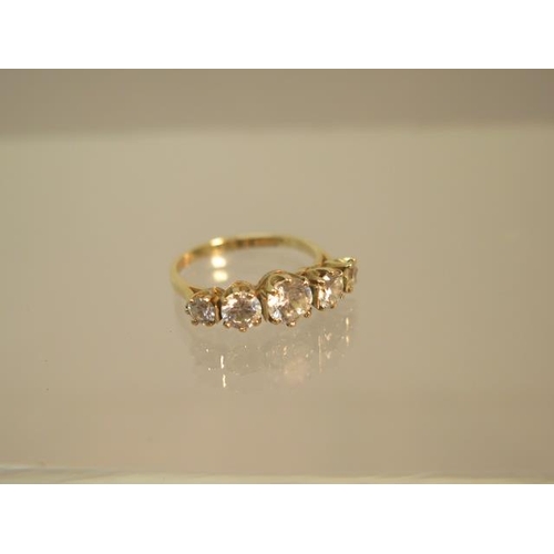 107 - A 9ct yellow gold (hallmarked) five stone ring with CZ - ring size O - weight approx 3 grams