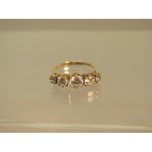 107 - A 9ct yellow gold (hallmarked) five stone ring with CZ - ring size O - weight approx 3 grams