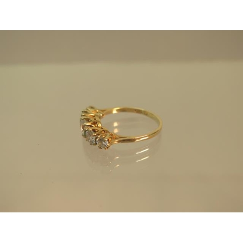 107 - A 9ct yellow gold (hallmarked) five stone ring with CZ - ring size O - weight approx 3 grams