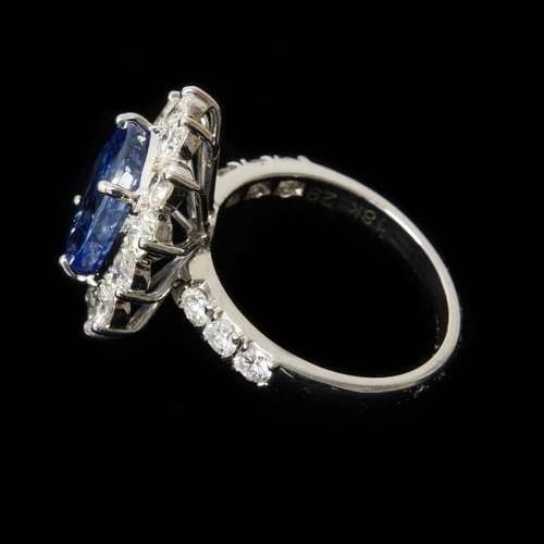 110 - A certificated 18ct white gold round cushion cut sapphire and round brilliant cut diamond cluster ri... 