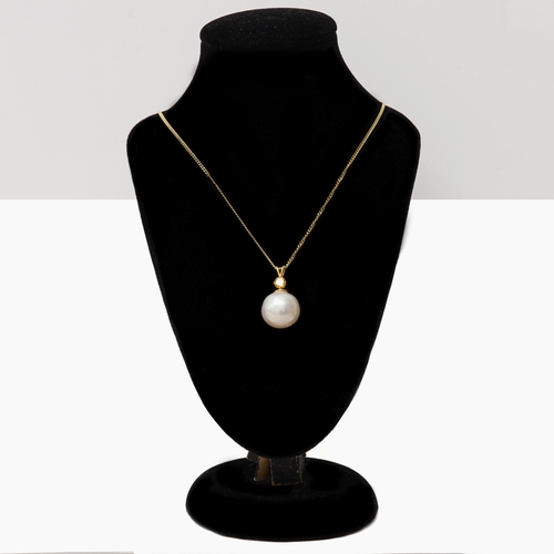 117 - A large 9ct yellow gold cultured pearl and citrine pendant on a gold-plated silver chain