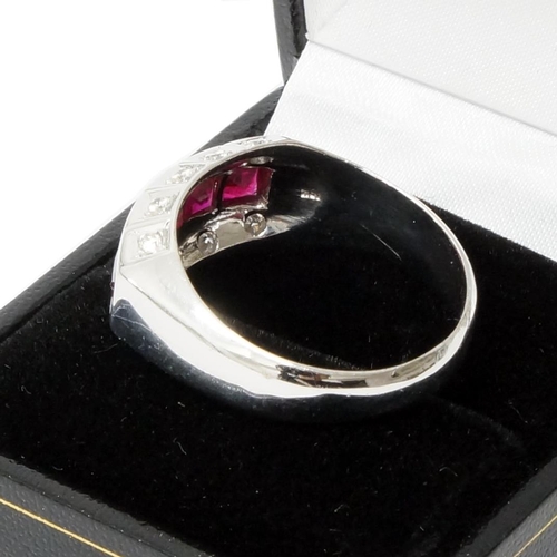 126 - A handmade 18ct white gold Art Deco style ring (10.1g) channel set with princess cut rubies, with ro... 