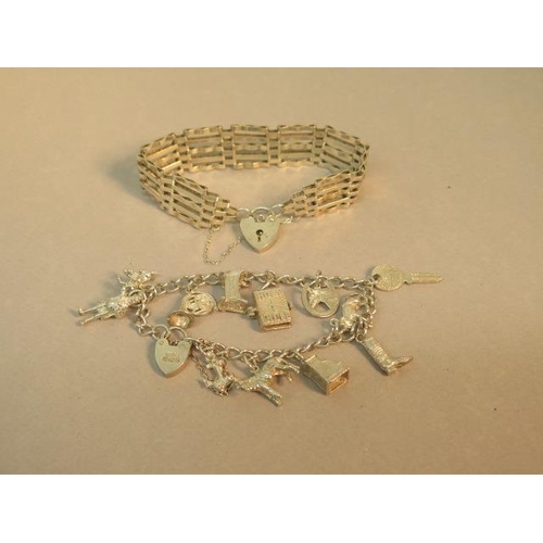 130 - A silver charm bracelet (12 charms) and a silver gate-link bracelet with heart lock - total weight a... 