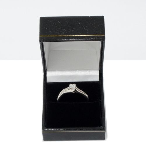 136 - A 9ct white gold princess-cut diamond solitaire ring with wave shoulders, ring size X/Y - Diamond 0.... 