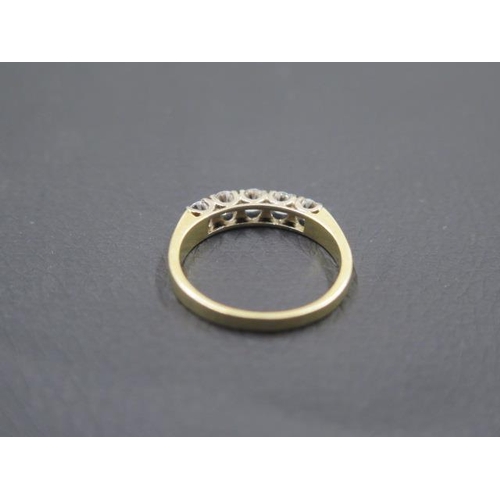 140 - A good 18ct yellow gold five stone diamond ring - five even round brilliant cut diamonds - approx 0.... 