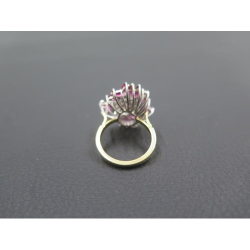 141 - A striking diamond and ruby cluster ring in 18ct yellow gold and platinum - ring size N - weight app... 