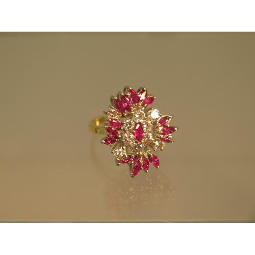 141 - A striking diamond and ruby cluster ring in 18ct yellow gold and platinum - ring size N - weight app... 