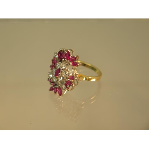 141 - A striking diamond and ruby cluster ring in 18ct yellow gold and platinum - ring size N - weight app... 