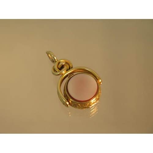 143 - An unusual 9ct (tested) yellow gold swivel fob set with compass (working) finely chased case hinged ... 