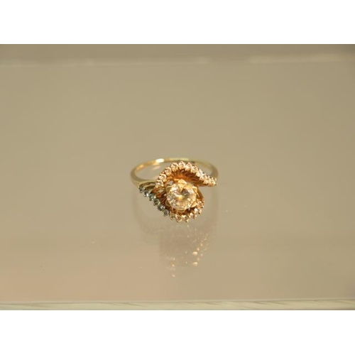 148 - A 9ct yellow gold (hallmarked) dress ring with white stones - ring size M/N - weight approx 3.6 gram... 