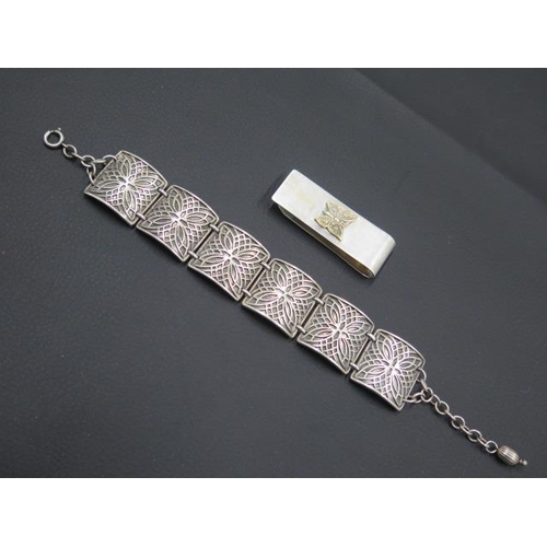 152 - A .925 silver money clip together with an .800 silver bracelet - total weight approx 1.7 troy oz