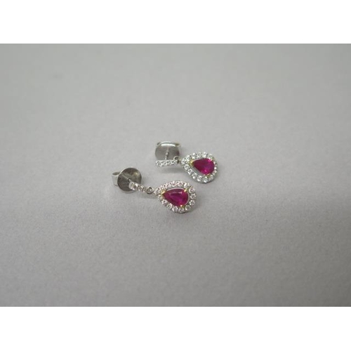 163 - A pair of ruby and diamond cluster drop earrings in 18ct white gold (hallmarked) - approx 1.8cm - we... 