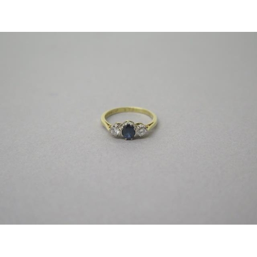 165 - An 18ct yellow gold (hallmarked) three stone sapphire and diamond ring size K/L - weight approx 2.5 ... 