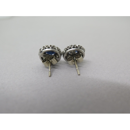 169A - A pair of sapphire and diamond cluster ear studs - central round sapphires approx 5mm diameter surro... 