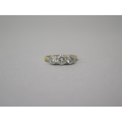 175 - An 18ct yellow gold (hallmarked) three stone diamond ring - central diamond approx 0.5ct - total dia... 