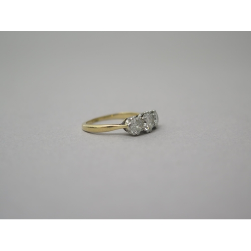 175 - An 18ct yellow gold (hallmarked) three stone diamond ring - central diamond approx 0.5ct - total dia... 