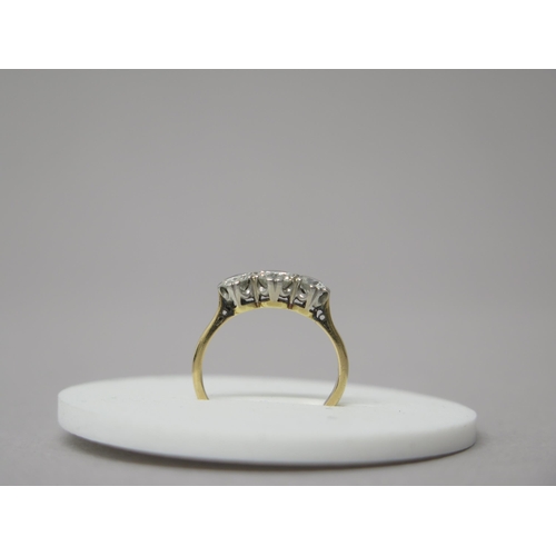 175 - An 18ct yellow gold (hallmarked) three stone diamond ring - central diamond approx 0.5ct - total dia... 