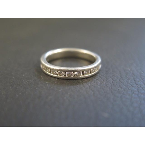 A platinum and diamond half eternity ring size L/M - weight approx 6.6 grams - with retailers certificate