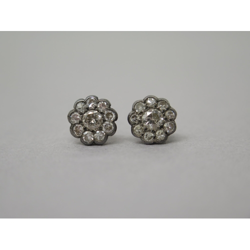 181 - A pair of yellow gold diamond cluster ear studs - approx 1cm diameter - central diamonds approx 0.25... 