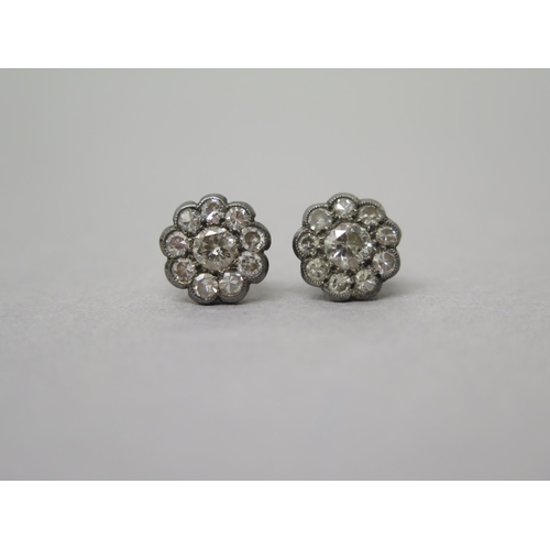 181 - A pair of yellow gold diamond cluster ear studs - approx 1cm diameter - central diamonds approx 0.25... 