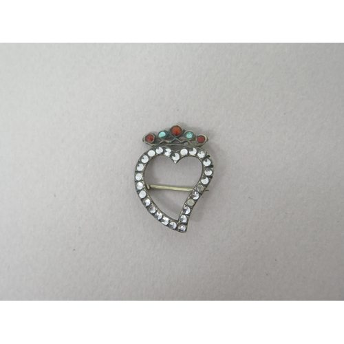 184 - A Georgian silver and paste heart brooch set with white, red and green paste stones - approx 3cm - w... 