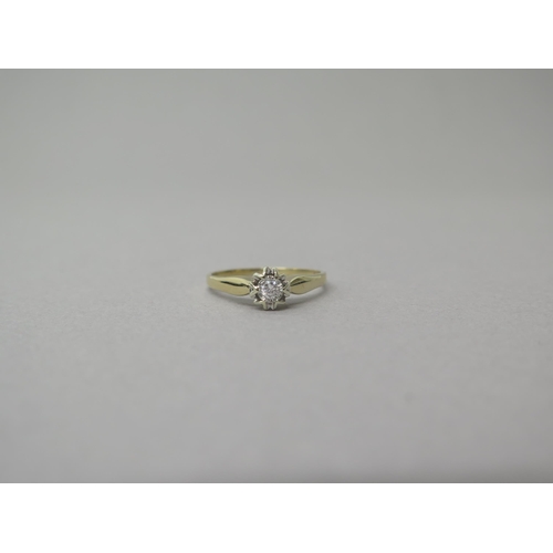 205 - A 9ct yellow gold solitaire diamond ring - head size approx 7mm diameter - ring size T