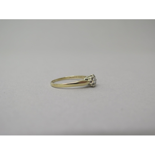 205 - A 9ct yellow gold solitaire diamond ring - head size approx 7mm diameter - ring size T