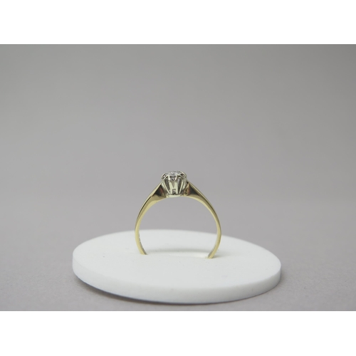 205 - A 9ct yellow gold solitaire diamond ring - head size approx 7mm diameter - ring size T