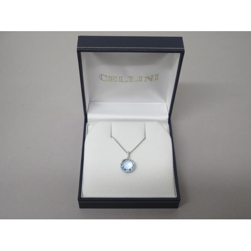 211 - A blue topaz and diamond pendant on chain set in 18ct white gold (hallmarked) chequer board cut roun... 