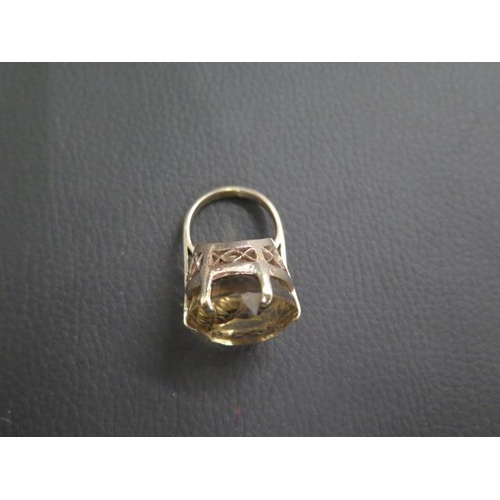 22 - A large 9ct (tested) yellow gold and quartz ring - round quartz approx 2cm diameter - ring size L/M ... 