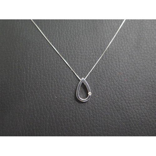 23 - A 9ct white gold pendant on chain, tear drop shaped pendant approx 1.5cm - set with diamond accent, ... 