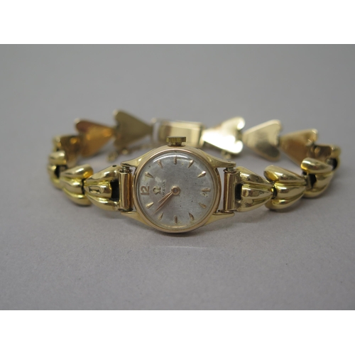 232 - A ladies Omega rose gold (hallmarked) cased watch with yellow gold (tested) bracelet - not currently... 