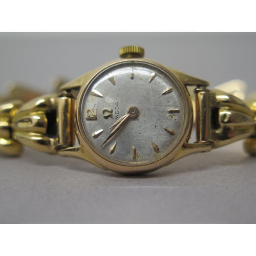 232 - A ladies Omega rose gold (hallmarked) cased watch with yellow gold (tested) bracelet - not currently... 