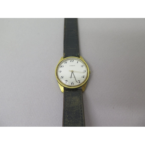 236 - A gents Tissot gold plated wristwatch - round case approx 33mm - working in the saleroom