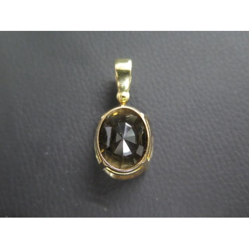 24 - An 18ct (tested) yellow gold and smokey quartz drop pendant, oval shaped quartz approx 2.5cm x 2cm -... 